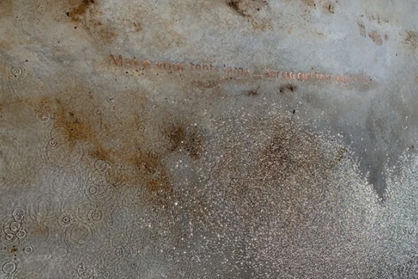 Alt="Copper words embedded in concrete floor