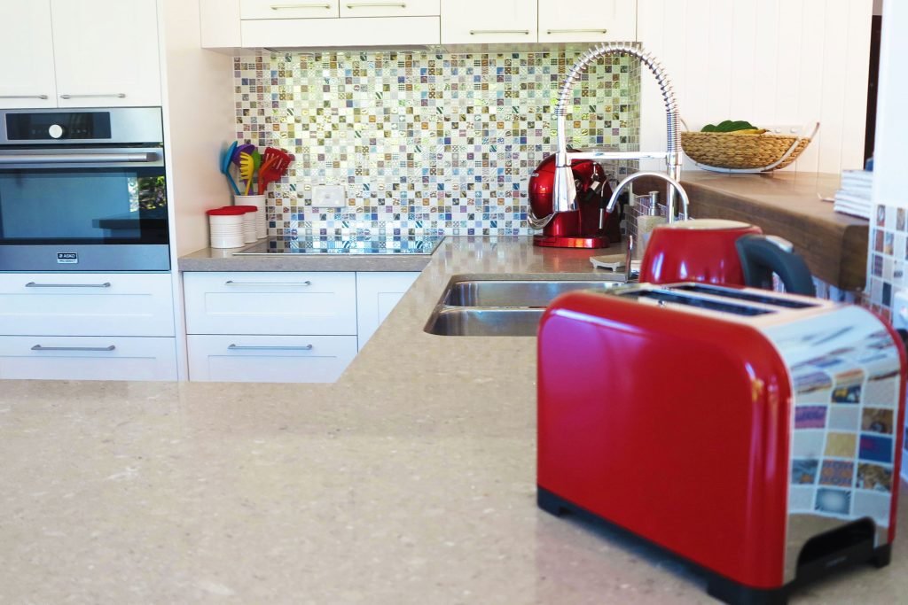 Interior Design Process Appliance Selection Kitchen with red toaster and kettle